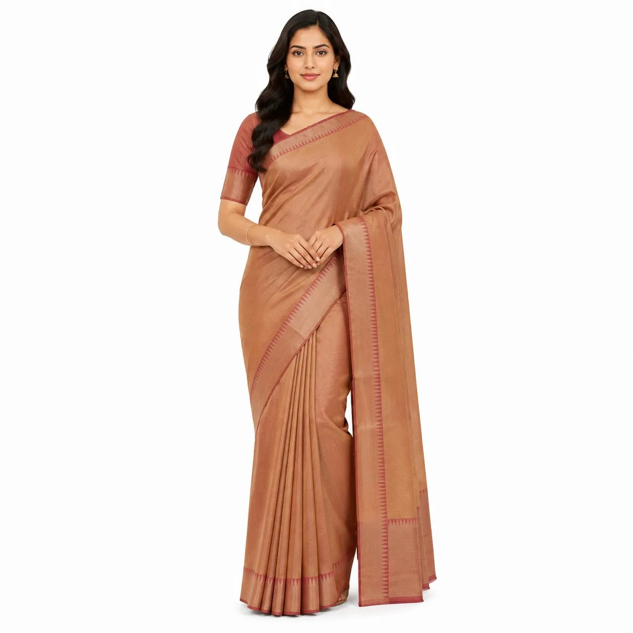 A woman modeling a traditional brown silk saree with red border accents, set against a plain white background.